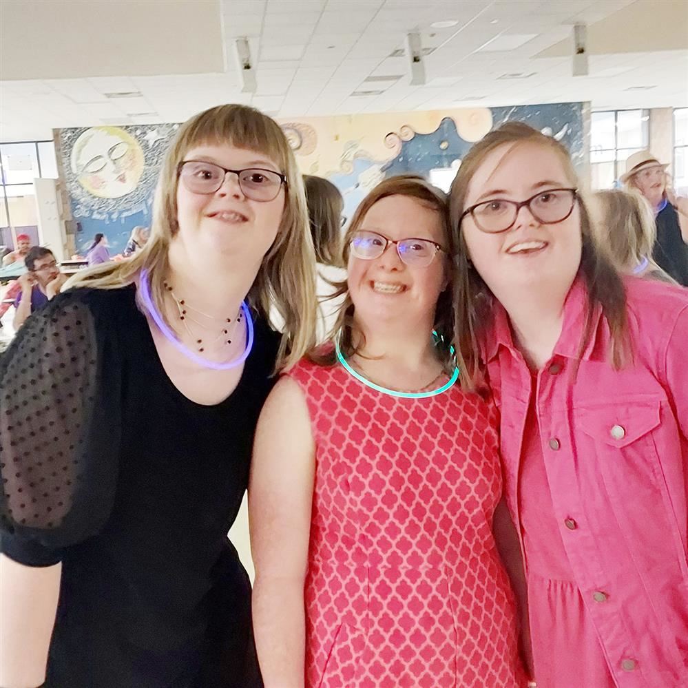  Three women smiling